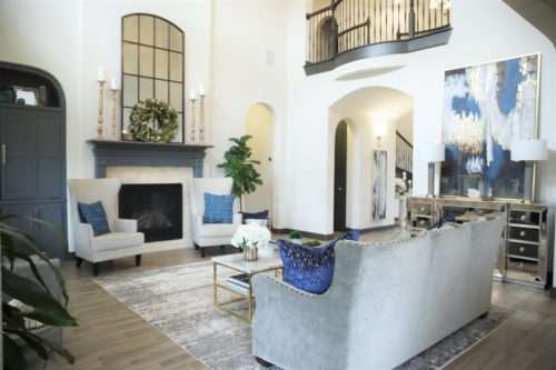 living room decor, living room colors, blue living room, gray sofa, bar stools at island. ivory kitchen, summer decor, blue summer decor, summer living room, colorful living room, coffee table, marble coffee table, coffee table decor, hydrangeas, blue vases, built ins, living room built ins, display box, living room pillows, blue pillows, navy pillows, summer decor, greek key pillow