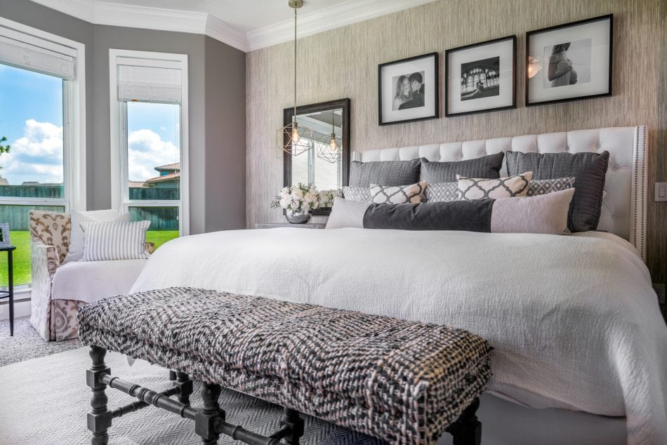master bedroom. transitional, transitional bedroom, master suite. wallpaper, bedroom, windows, accent chairs, lumbar, dresser, nightstands, bedroom bench, area rug, neutral bedroom, white bedroom, personal, pendant lights over night stand