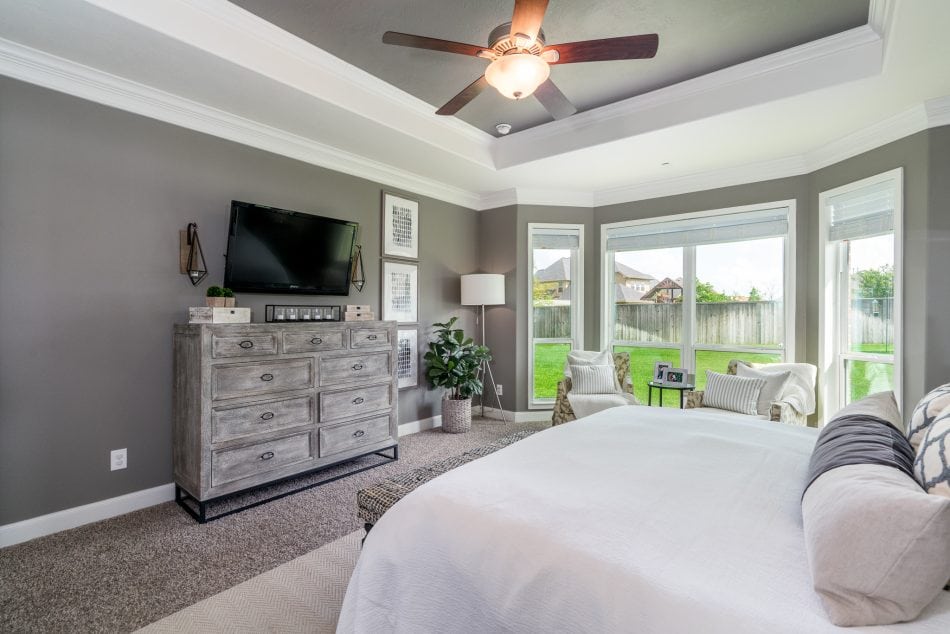 master bedroom. transitional, transitional bedroom, master suite. wallpaper, bedroom, windows, accent chairs, lumbar, dresser, nightstands, bedroom bench, area rug, neutral bedroom, white bedroom, personal, pendant lights over night stand