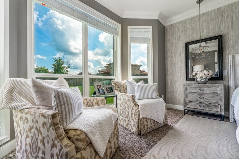 master bedroom. transitional, transitional bedroom, master suite. wallpaper, bedroom, windows, accent chairs, lumbar, dresser, nightstands, bedroom bench, area rug, neutral bedroom, white bedroom, personal, pendant lights over night stand