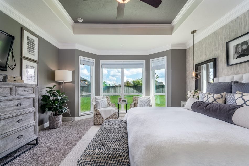 master bedroom. transitional, transitional bedroom, master suite. wallpaper, bedroom, windows, accent chairs, lumbar, dresser, nightstands, bedroom bench, area rug, neutral bedroom, white bedroom, personal, pendant lights over night stand