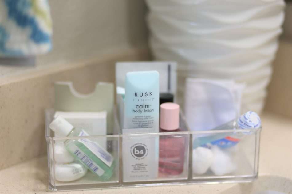 feminine guestroom, girl guestroom, guestroom, boutique style guest room, colorful guestroom, accent chair in guest room, black bed, wooden bed, floor mirror, textured bedding, guest bedroom decor