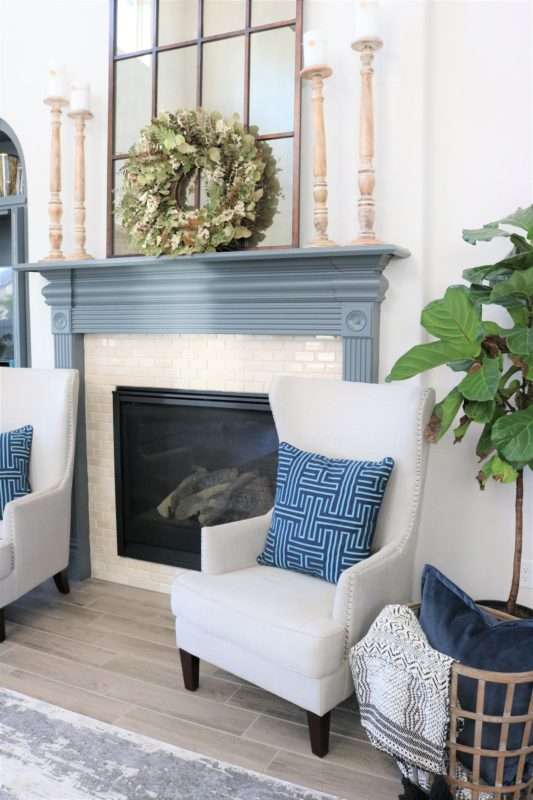 blue accessories, blue decor, living room with blue decor, gray sofa, living room decor, living room, neutral living room, pops of blue, blue colors in living room, blue pillows, blue vases, wooden coffee table
