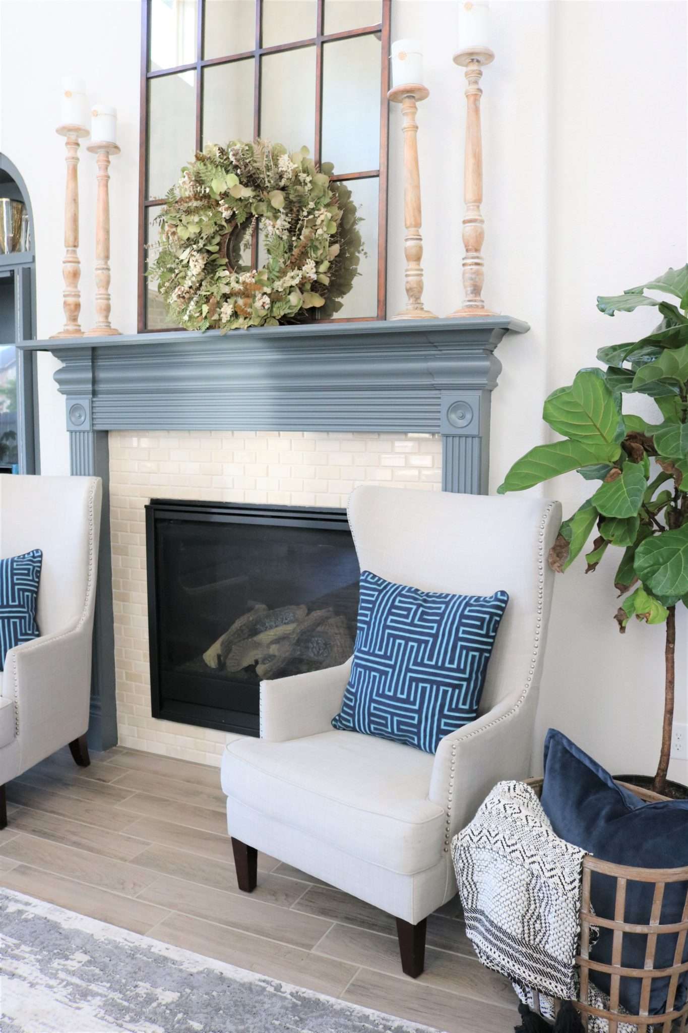 blue accessories, blue decor, living room with blue decor, gray sofa, living room decor, living room, neutral living room, pops of blue, blue colors in living room, blue pillows, blue vases, wooden coffee table