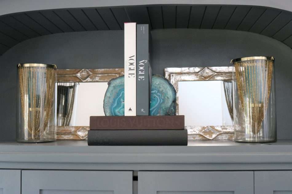 blue accessories, blue decor, living room with blue decor, gray sofa, living room decor, living room, neutral living room, pops of blue, blue colors in living room, blue pillows, blue vases, wooden coffee table