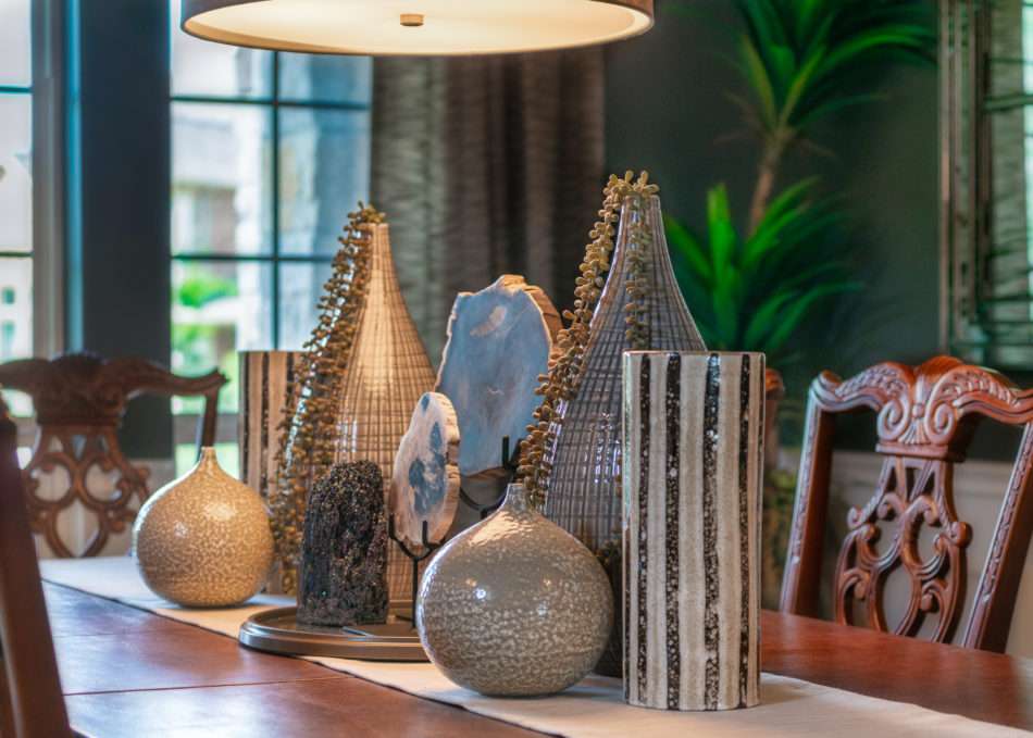 table books, books on coffee table, books on table, coffee table decor, how to accessorize like a pro, boxwood on table, mixing materials, coffee table accessories, accessorizing, how to accessorize, how to layer books, how to decorate like a pro, how to decorate with books, display case, agate stone, agate stone in display case, decorating in odd numbers, the rules of three, how to decorate in odd numbers