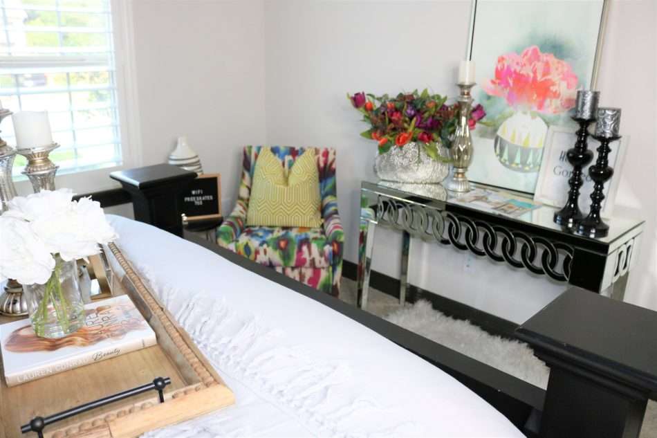 chic guestroom, chic, girl guestroom, guestroom. how to style a guest room, colorful chair, mirror over bed, colorful room, guestroom styling, guestroom check list