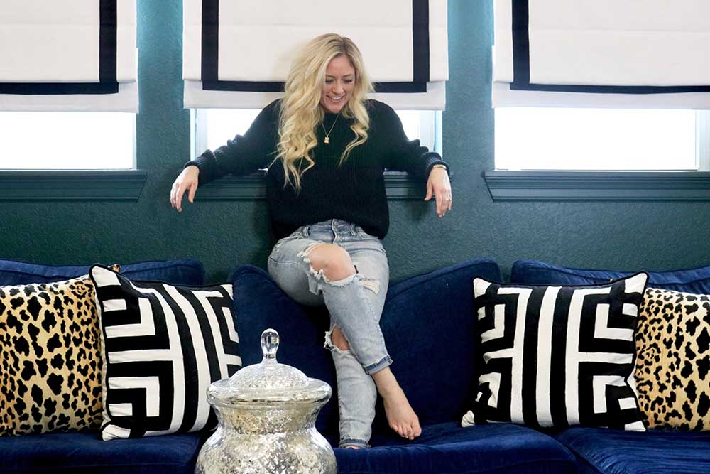 Melissa on navy blue sofa