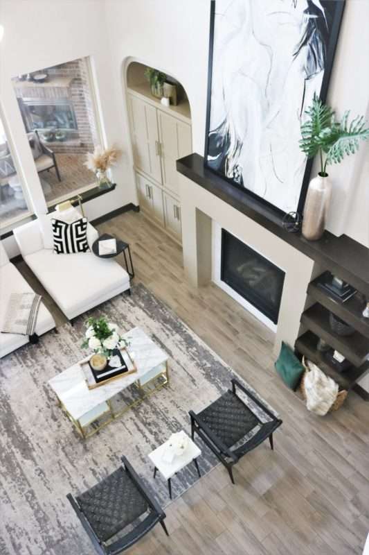 Beaumont Interior Designers, creating balance on wall with fireplace, design modern fireplace, designing floating shelves, fireplace remodel reveal, fireplace with floating shelves, grand fireplace, houston interior design, Houston Interior Designers, how to design a modern fireplace, How to remodel a fireplace, How to scale a fireplace remodel, Melissa Roberts Interiors, Modern Fireplace Remodel, mri, original fireplace designs, remodel dated fireplace, step by step guide to remodeling fireplace, tile to use for fireplace, unique fireplace design, unique fireplace elements, what color to paint cabinets, what color to paint shelves, What stain color to use for shelves