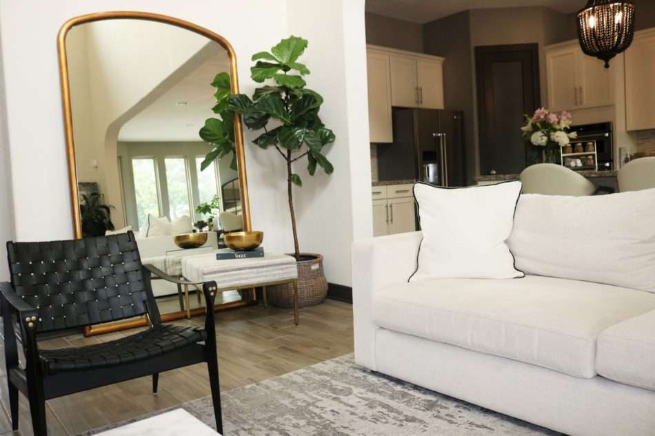 MRI, Melissa Roberts Interiors, Houston Interior Designer, Houston Interior Design, Beaumont Interior Design, Living Room Update, Living Room Reveal, Living Room Refresh, How to refresh your living room, summer living room, kitchen barstools, kitchen counter stools, kitchen pendant lights, living in your home during construction, fireplace remodel, modern fireplace, white sofa, wall mirror, gold wall mirror, chase lounge, unique chairs, living room accessories, how to style your living room, how to stage your living room, 2019 Living Rooms, minimalist design