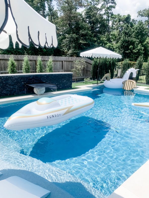 modern patio, modern outdoor furniture, modern patio decor, modern pool design, contemporary pool design, contemporary patio, fall patio decor, modern furnished patio, modern pool. black and white patio, black and white outdoor rug, outdoor sofa, outdoor chaise lounges, styled patio, styled pool, styled chaise lounges, towel rack, pool towels, towels by the pool, pool towel storage, pool storage solutions, outdoor dining, dining table, outdoor dining table, outdoor chandelier, patio dining table, outdoor planters, modern planters