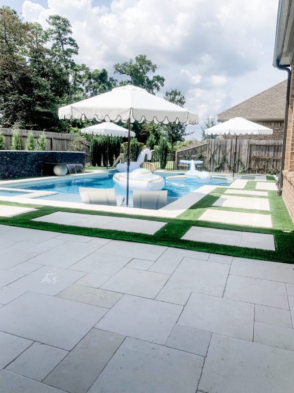 modern patio, modern outdoor furniture, modern patio decor, modern pool design, contemporary pool design, contemporary patio, fall patio decor, modern furnished patio, modern pool. black and white patio, black and white outdoor rug, outdoor sofa, outdoor chaise lounges, styled patio, styled pool, styled chaise lounges, towel rack, pool towels, towels by the pool, pool towel storage, pool storage solutions, outdoor dining, dining table, outdoor dining table, outdoor chandelier, patio dining table, outdoor planters, modern planters