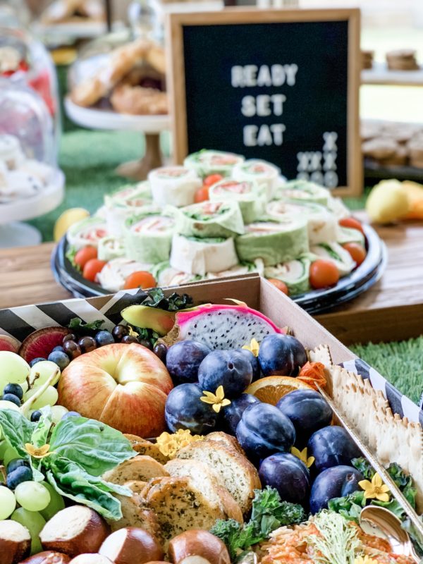 football party, epic football party, party ideas, football party ideas, college football, football koozies, hosting ideas, charcuterie board, cheese tray, food table, ready set eat, football table decor, grazeables