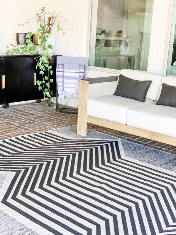 modern patio, modern outdoor furniture, modern patio decor, modern pool design, contemporary pool design, contemporary patio, fall patio decor, modern furnished patio, modern pool. black and white patio, black and white outdoor rug, outdoor sofa, outdoor chaise lounges, styled patio, styled pool, styled chaise lounges