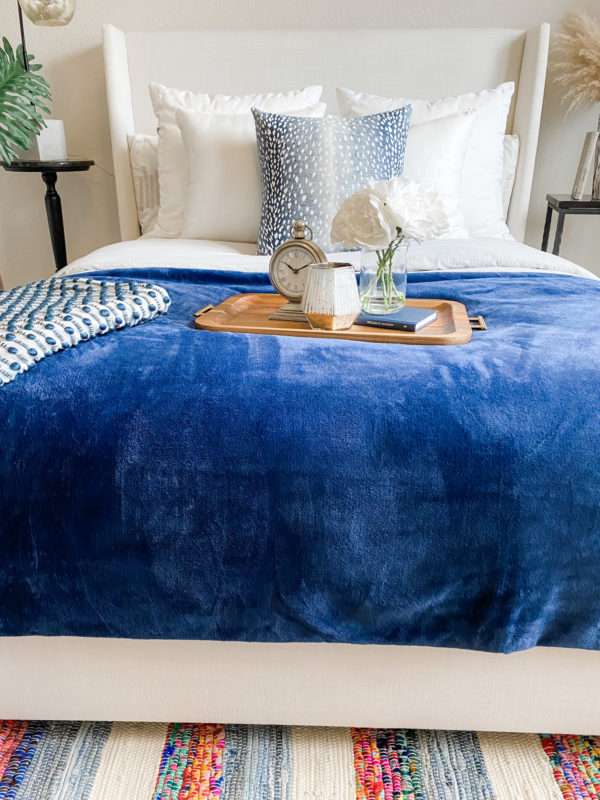 Make your bed, styling your bed, how to style your bed, pretty pillows, making your bed, comforter on the bed, how to style your bed like a proMRI, Melissa Roberts Interiors, Houston Interior Design, Houston Interior Designer, How to Make a Bed Like a Pro, Pottery Barn Bed, Duvet Cover, Pillows, Fur Pillows, Throws, Styling a Bed, Styling a Bed Like a Pro, How to Style a Bed, How to Style a Bed Like a Pro, Affordable Sheets, Affordable Bedding, Chic Quilts, Quilts, Pillow Covers, Pillow Sizing for a bed, Hospital Corners, Pillow Sizing Guide, how to add an accent color to your bedroom, adding an accent color, accent color Throw blanket, 2020, classic blue, color of the year 2020, navy, navy blanket, navy throw blanket