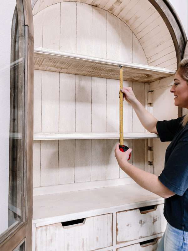 MRI, Melissa Roberts Interiors, Houston Interior Design, Houston Interior Designers, Arched Cabinet, Bookcase, Styling a Cabinet, Styling a Bookcase, Book Shelf, Styling a Bookshelf, How Interior Designer Style a bookcase, Modern, Modern Styled shelf, Style a Bookcase Like a pro, styling a cabinet with books, staging a bookcase, staging, how to stage a home, home décor, home décor ideas, bookcase hack, styling hacks, updating old bookcase, before and after, how to decorate a bookcase, how to decorate a cabinet, modern styling, organic home décor, neutral color tones, neutral color tones home décor, floating shelf, etagere