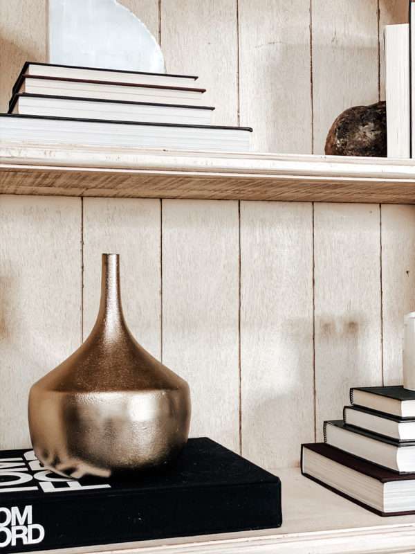 MRI, Melissa Roberts Interiors, Houston Interior Design, Houston Interior Designers, Arched Cabinet, Bookcase, Styling a Cabinet, Styling a Bookcase, Book Shelf, Styling a Bookshelf, How Interior Designer Style a bookcase, Modern, Modern Styled shelf, Style a Bookcase Like a pro, styling a cabinet with books, staging a bookcase, staging, how to stage a home, home décor, home décor ideas, bookcase hack, styling hacks, updating old bookcase, before and after, how to decorate a bookcase, how to decorate a cabinet, modern styling, organic home décor, neutral color tones, neutral color tones home décor, floating shelf, etagere